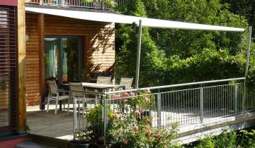 Sonnensegel Shadesign creme / natur, Holzhaus-Terrasse